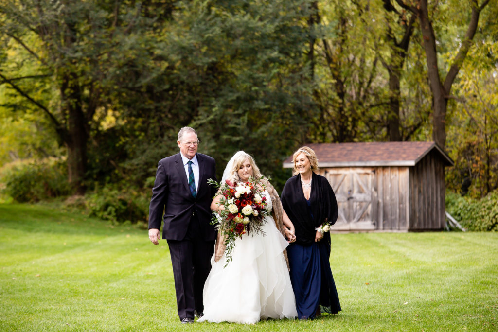 bride walking up the aisle Elm Hurst wedding photography by london ontario photographer Woodgate Photography