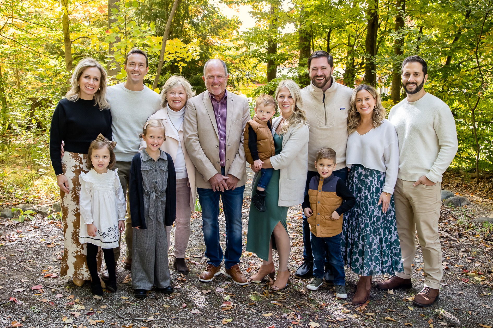 extended family photography london ontario wearing neutrals in fall at wonderland gardens
