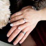 Hands with engagement rings and dog paws london ontario