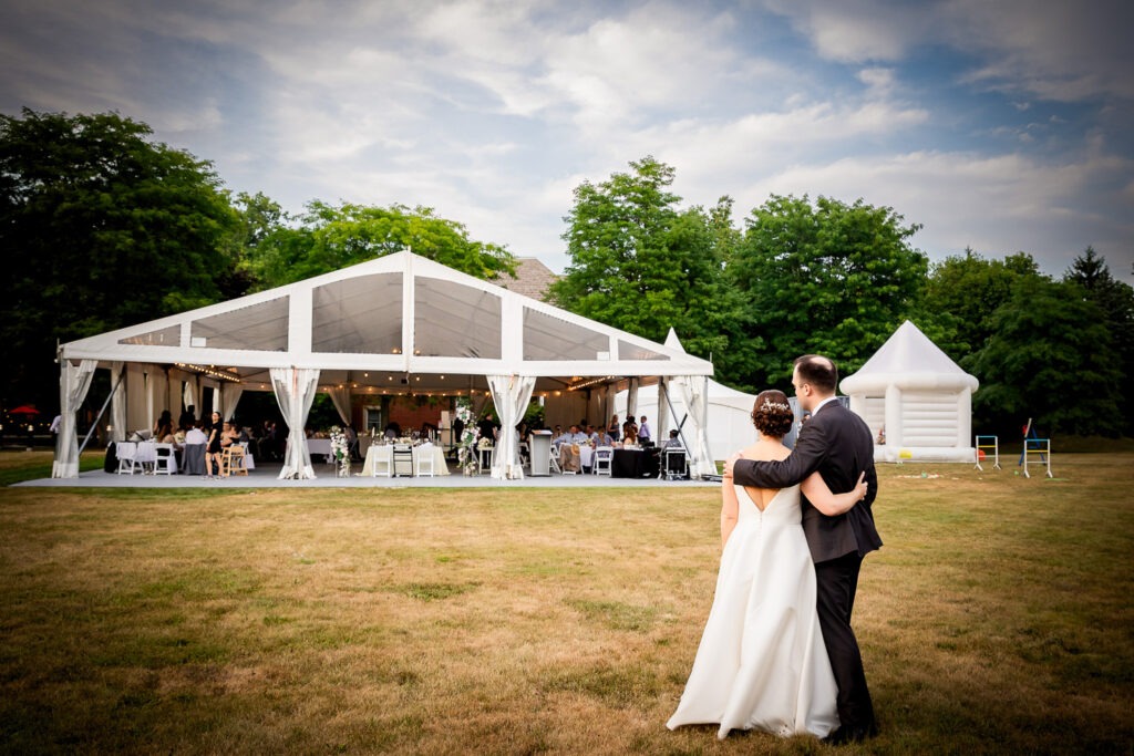 couple look at their outdoor wedding photography london ontario