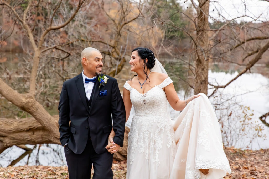 Couple walk holding hands at Mill Pond, Ontario wedding photography
